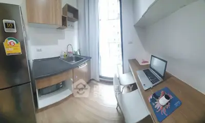 Modern compact kitchen with workspace and natural light