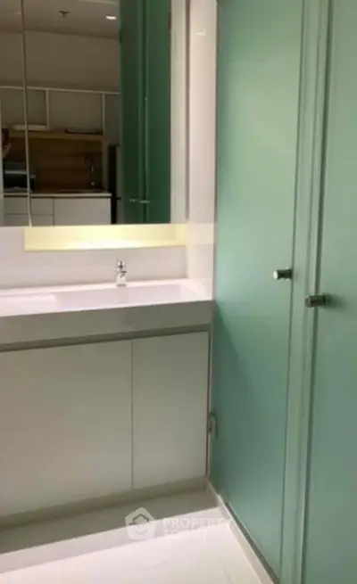 Modern bathroom with sleek design and frosted glass shower door