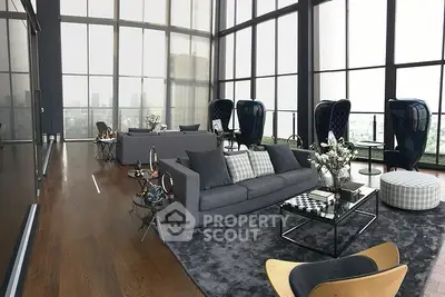 Luxurious modern living room with floor-to-ceiling windows and stunning city views.