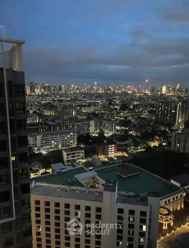 Stunning cityscape view from high-rise building at dusk, showcasing urban skyline.