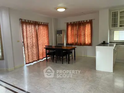 Spacious dining area with natural light and modern decor