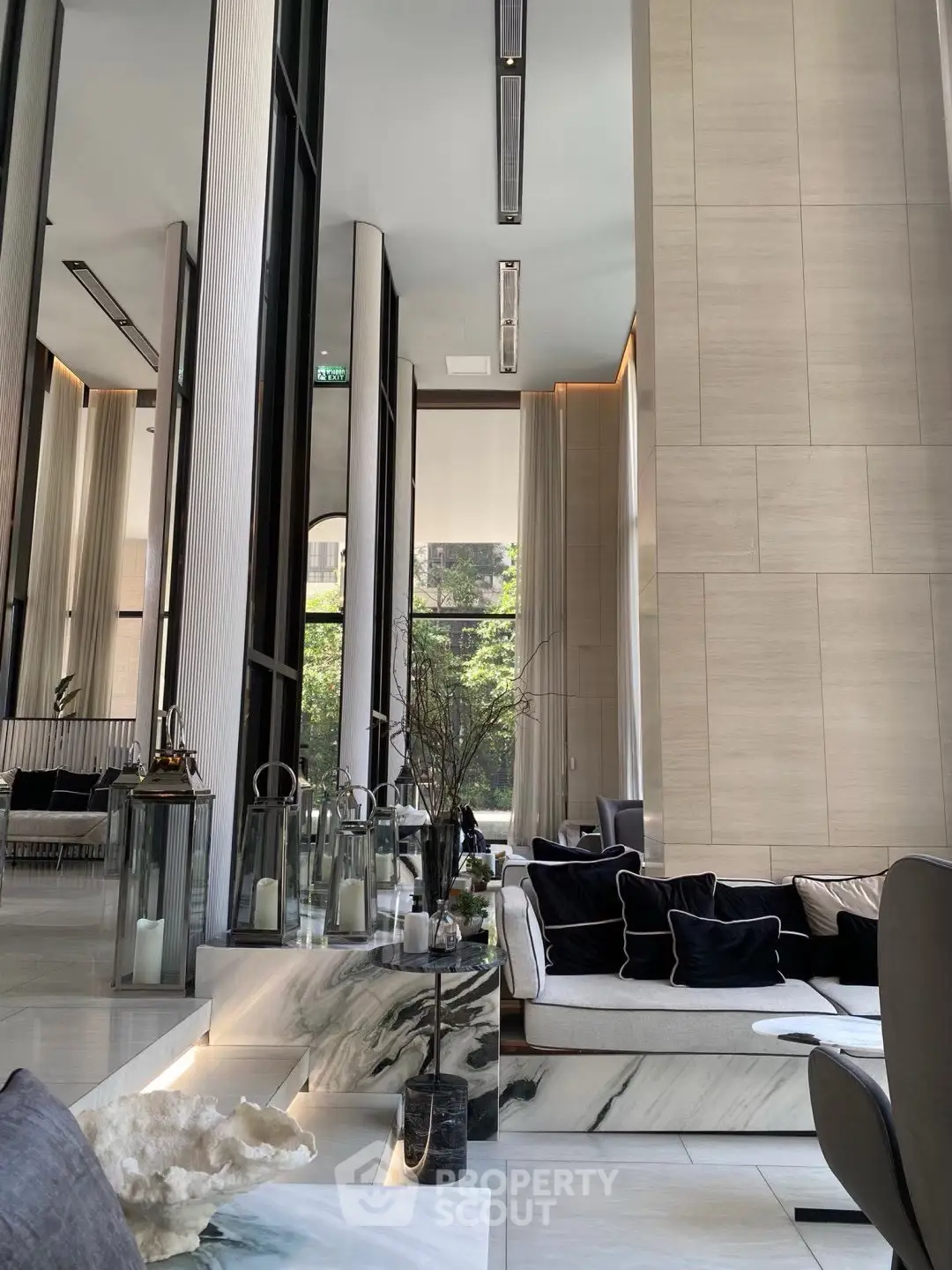 Luxurious modern living room with high ceilings and elegant decor