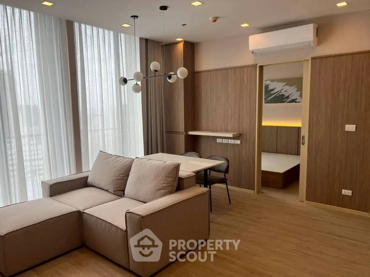 Modern living room with stylish lighting and cozy seating area