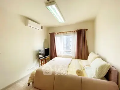 Cozy bedroom with natural light, air conditioning, and modern furnishings.