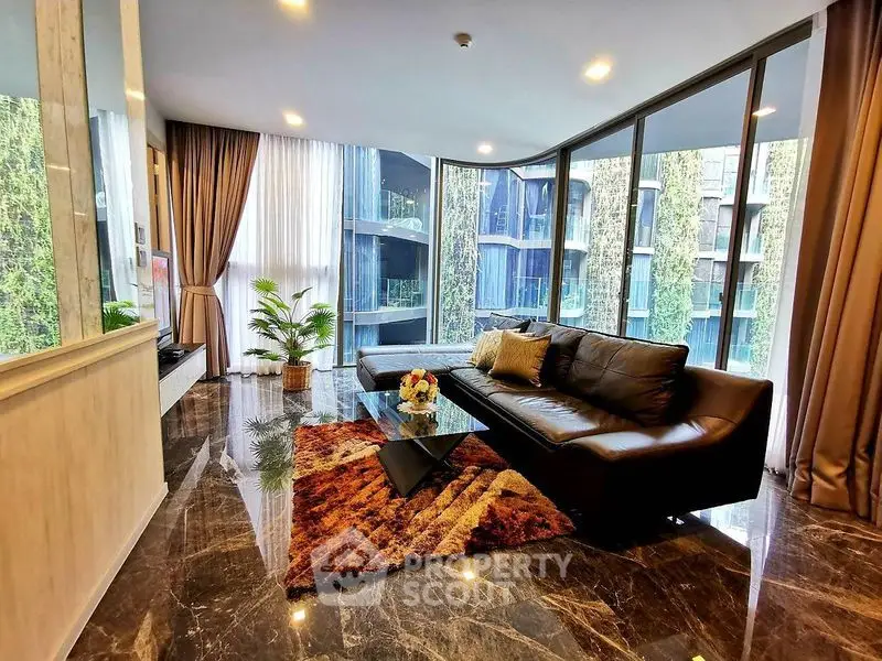 Luxurious living room with floor-to-ceiling windows and modern decor