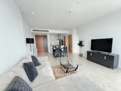 Spacious modern living room with open kitchen and stylish decor