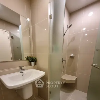 Modern bathroom with sleek design and glass shower enclosure