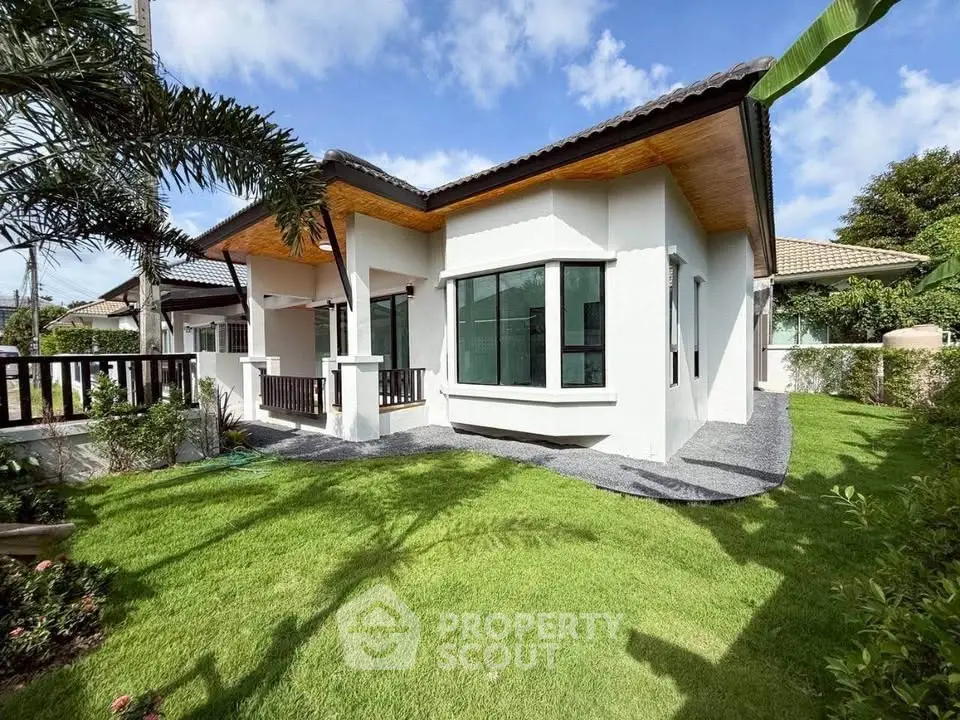 Charming single-story house with lush garden and modern design