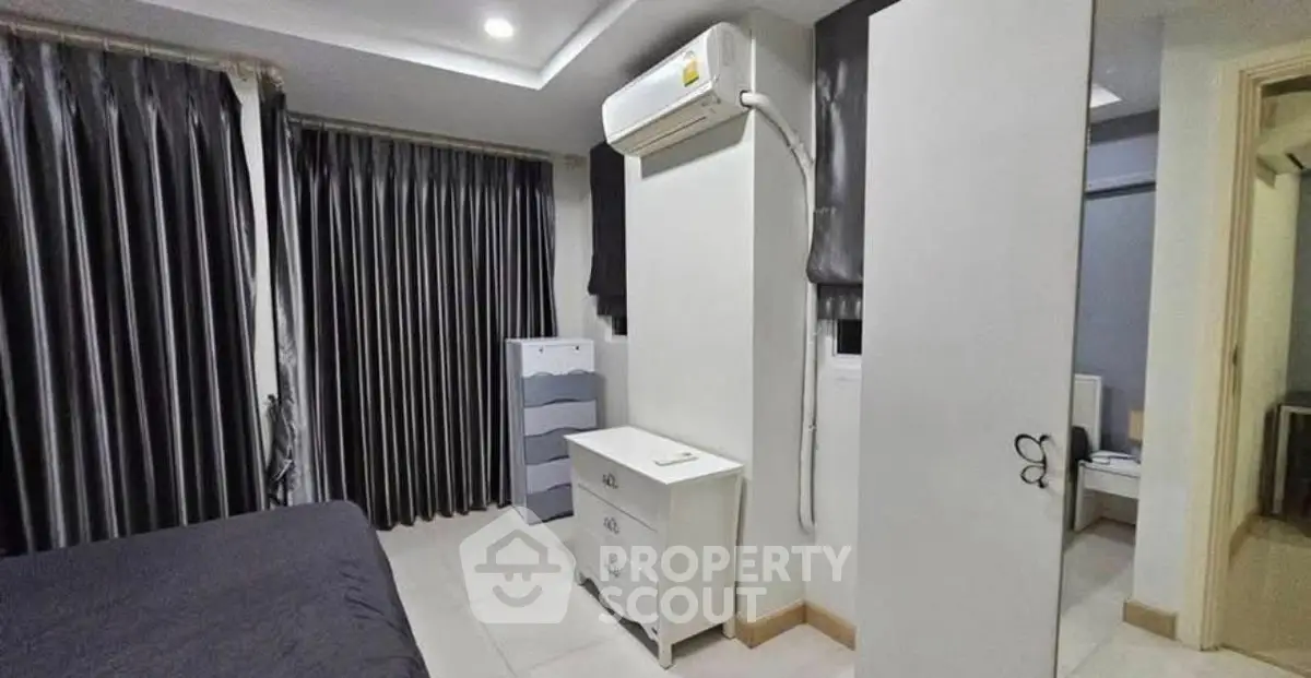 Modern bedroom with sleek design and air conditioning unit