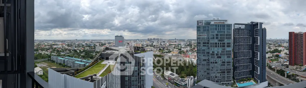 Stunning panoramic cityscape view from a high-rise building, showcasing modern architecture and expansive urban landscape.