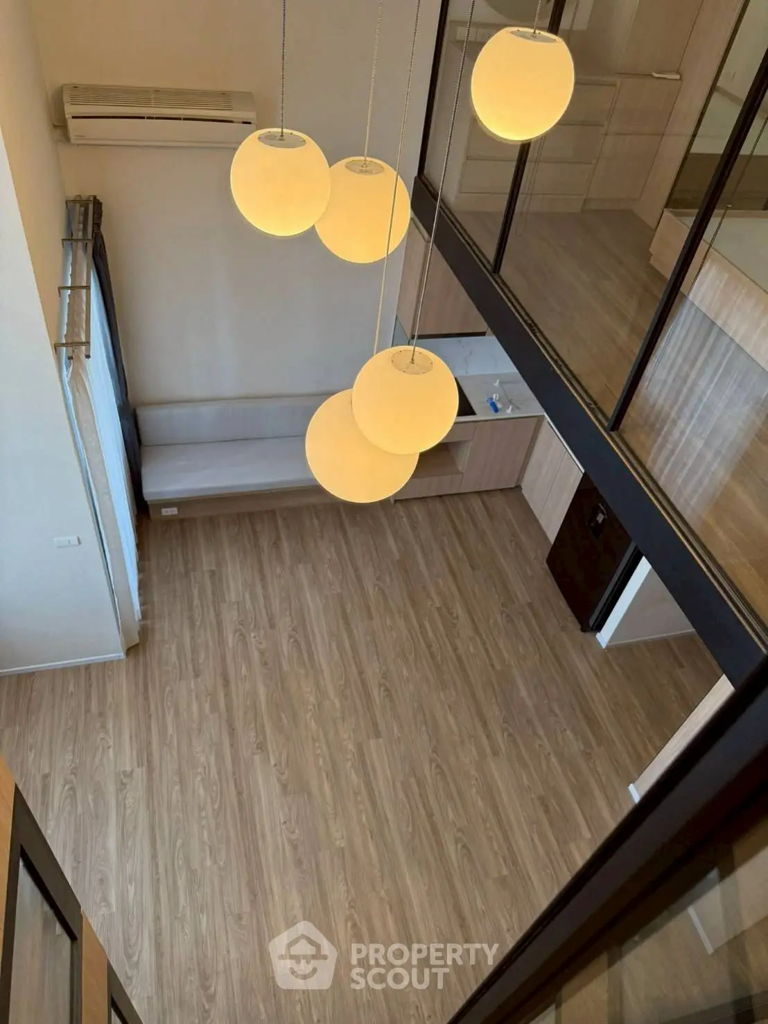 Spacious modern living room with high ceiling and elegant lighting