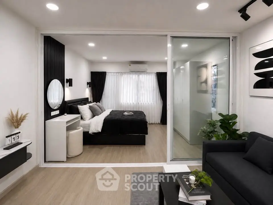 Modern studio apartment with stylish decor and cozy bedroom area