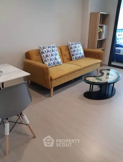 Modern living room with stylish yellow sofa and chic decor