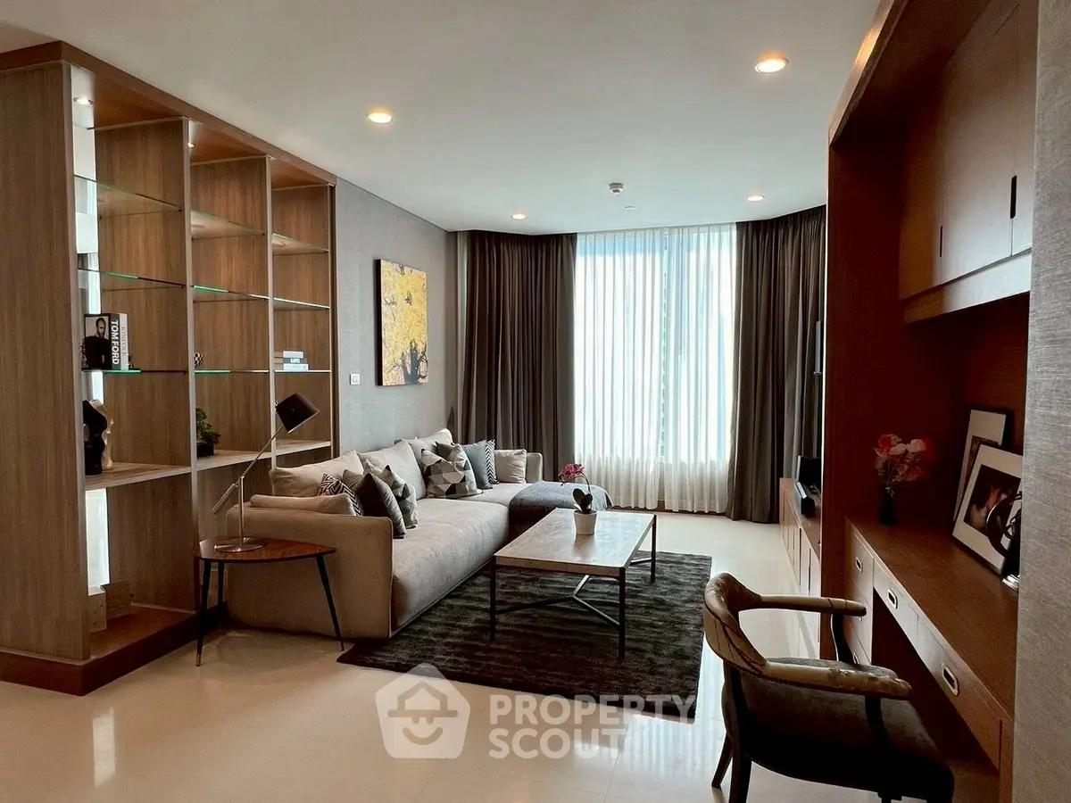Luxurious modern living room with elegant decor and large window for natural light.
