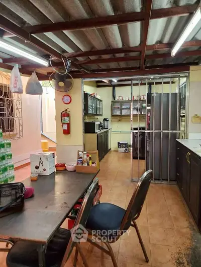 Spacious kitchen with modern appliances and ample storage in a cozy home setting.