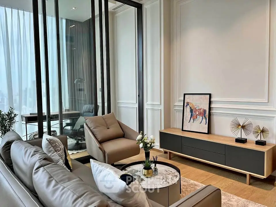 Luxurious modern living room with elegant decor and large windows for natural light.