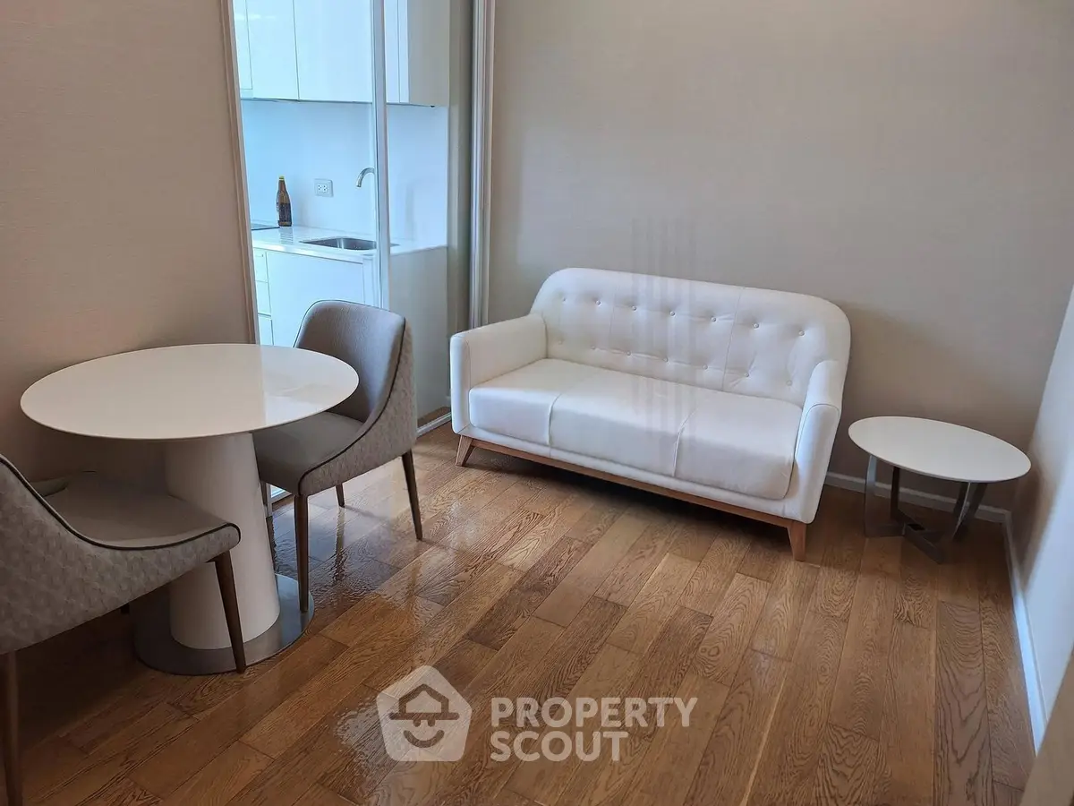 Modern living room with elegant white sofa and dining area in stylish apartment