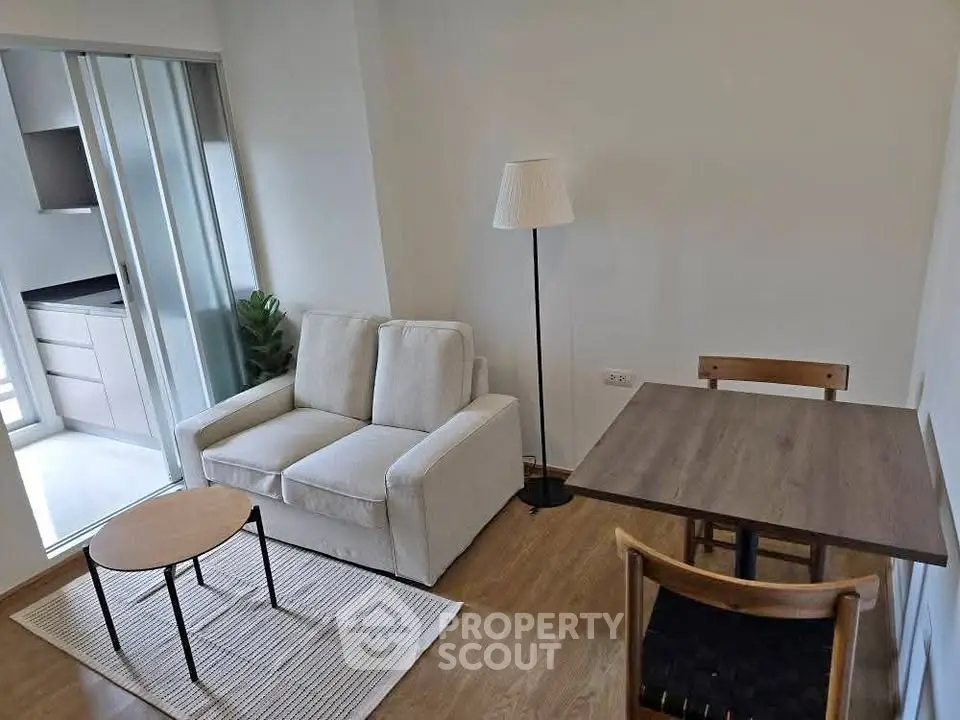 Cozy living room with modern furniture and natural light, perfect for relaxation and entertaining.