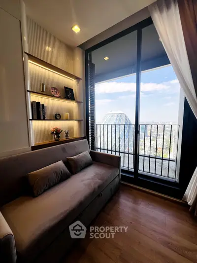Stylish living room with balcony and city view, featuring modern decor and cozy seating.