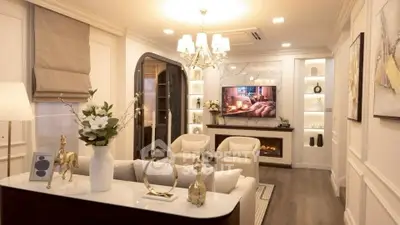 Luxurious living room with elegant decor and ambient lighting, featuring a cozy fireplace and modern furnishings.