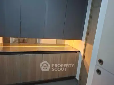 Modern kitchen with sleek cabinets and ambient lighting