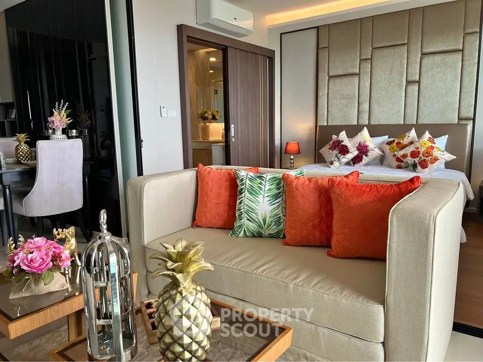 Luxurious modern living room with elegant decor and cozy seating in a stylish apartment.