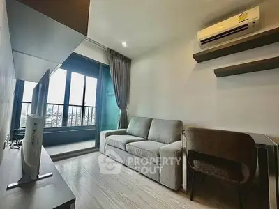 Modern living room with balcony view and air conditioning
