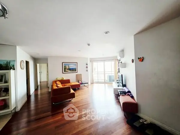 Spacious living room with hardwood floors and modern decor
