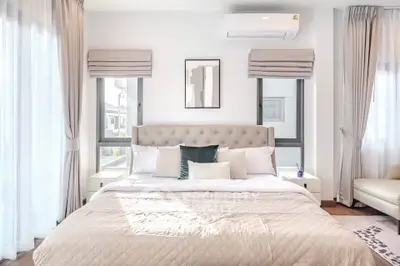 Luxurious bedroom with elegant decor and natural light