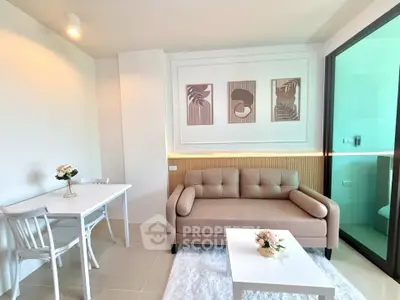 Modern living room with stylish decor and cozy seating area in a contemporary apartment.