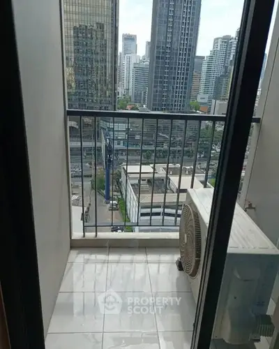 Urban balcony view with city skyline and air conditioning unit, perfect for city living enthusiasts.