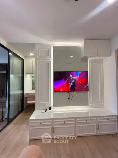 Modern living room with stylish TV wall unit and elegant decor