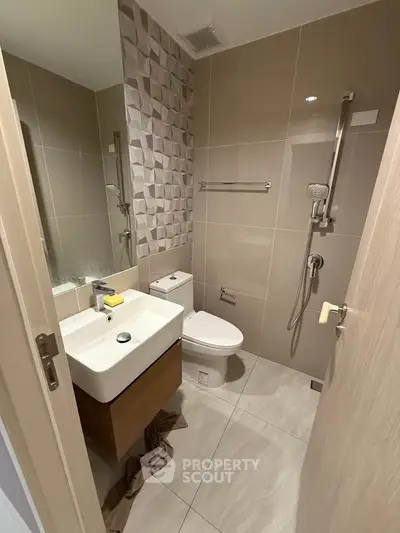 Modern bathroom with sleek fixtures and stylish tile design.