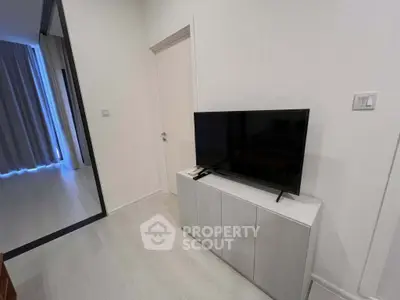 Modern living room with sleek TV setup and minimalist decor