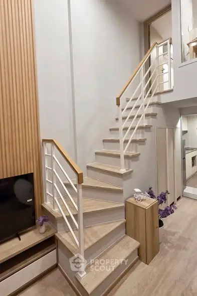 Modern interior with stylish staircase and wooden accents in a cozy living space