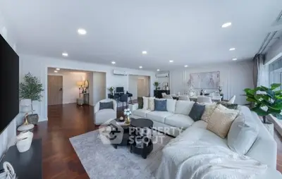 Spacious modern living room with elegant decor and open layout, perfect for entertaining.