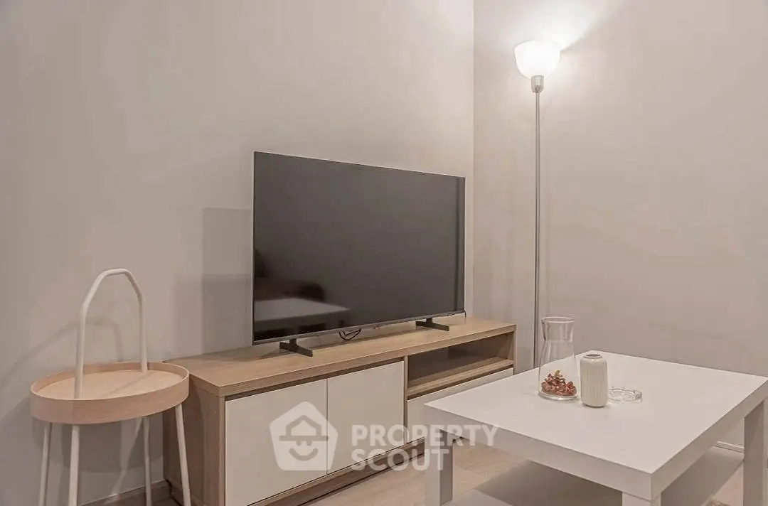 Cozy living room with modern TV setup and stylish furniture