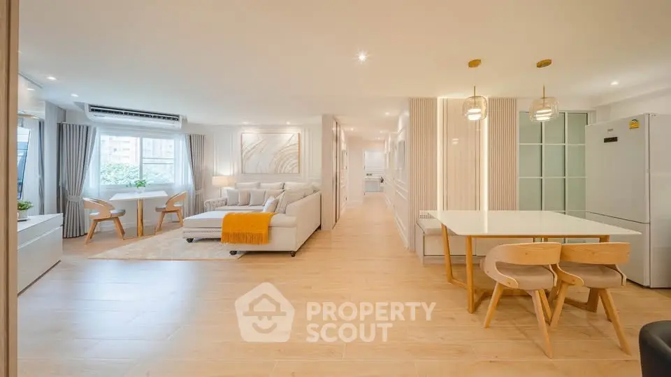 Spacious modern living room with open kitchen and elegant decor