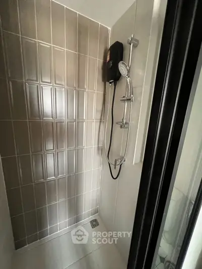 Modern bathroom shower with sleek tile design and high-quality fixtures.