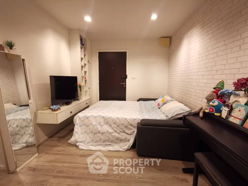 Cozy bedroom with modern decor and stylish furniture in a contemporary apartment.