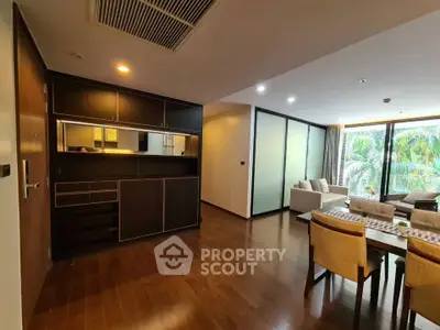 Spacious modern living room with wooden flooring and elegant dining area