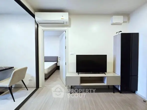 Modern living room with sleek furniture and air conditioning