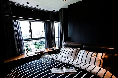 Luxurious bedroom with city view and stylish decor