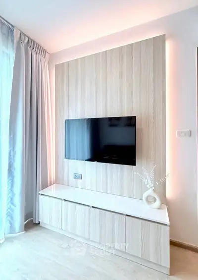 Modern living room with sleek TV setup and elegant decor