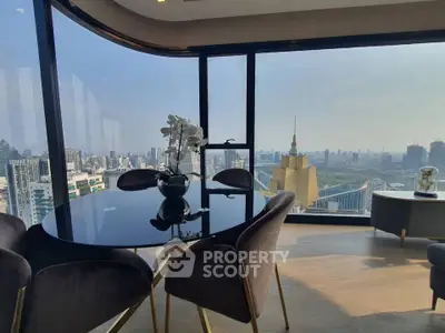 Luxurious high-rise apartment with stunning cityscape view and elegant dining area.