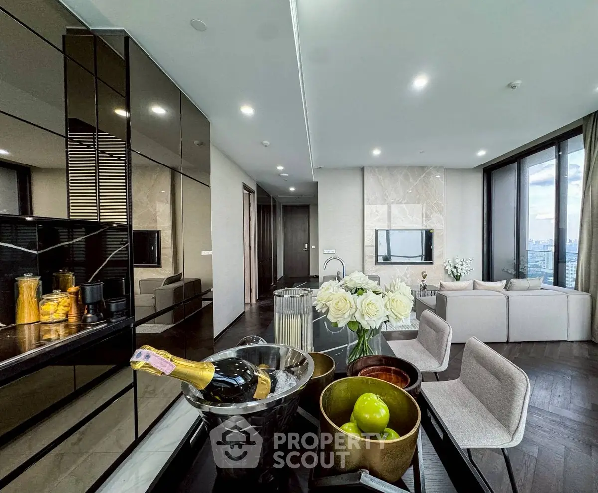 Luxurious modern living room with city view, elegant decor, and open layout.