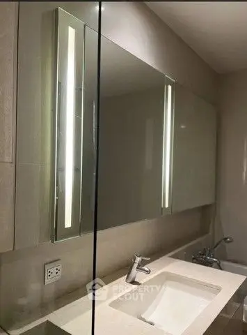 Modern bathroom with sleek mirror and elegant sink design