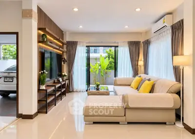 Spacious modern living room with large windows and stylish decor