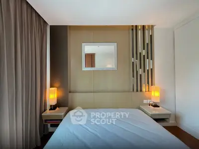 Modern bedroom with stylish decor and ambient lighting