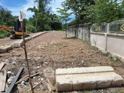 Vacant land with construction equipment and potential for development